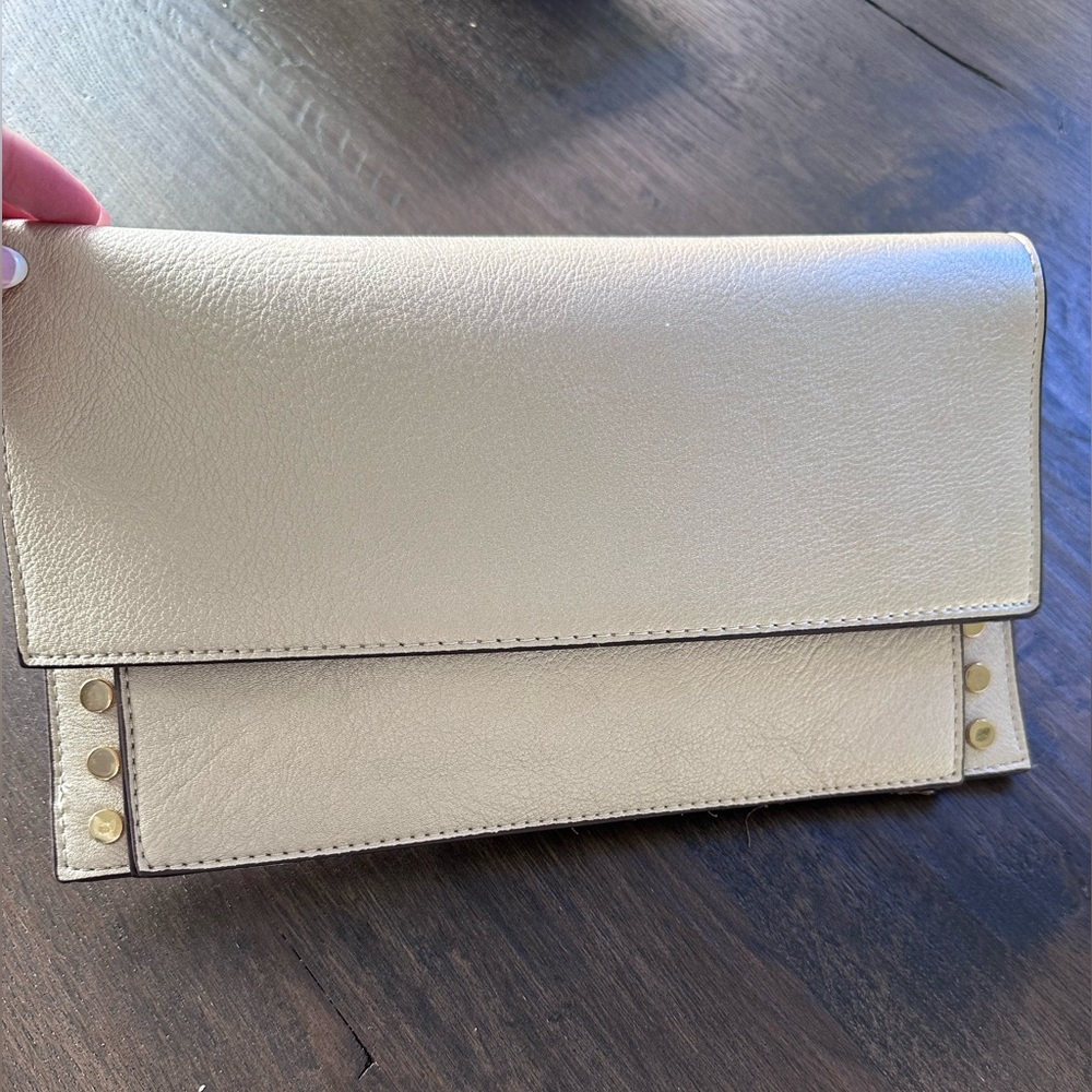 CHICO’s light gold clutch, NWT.